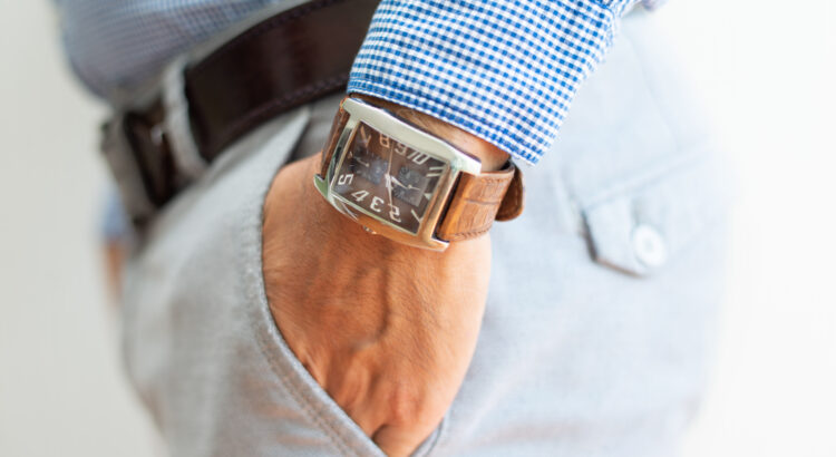 closeup of business man keeping hand in trousers pocket